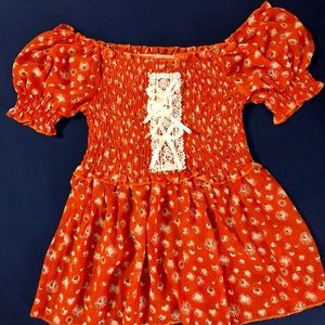 Orange floral blouse